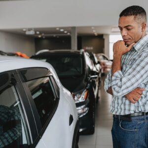 Man analyzing car to buy